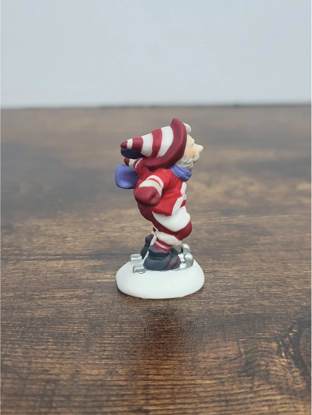 Department 56 Santa Figurine with Blue Scarf on Skates